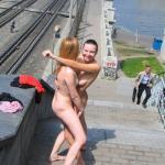 girls naked outdoors Hugging on rail bridge