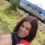 Big smile while flashing titties for train passing by