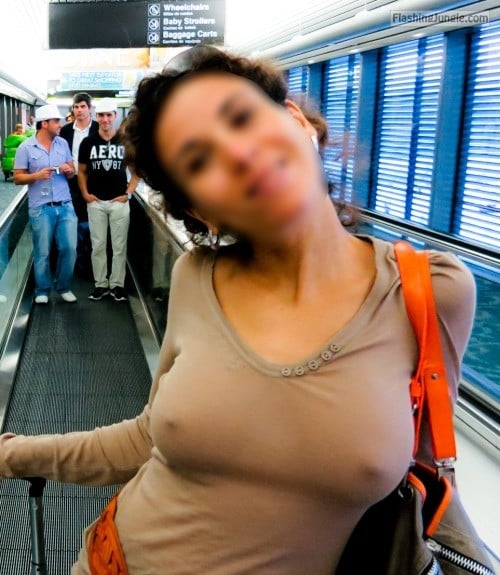 Braless and horny at the airport public flashing pokies pics boobs flash 