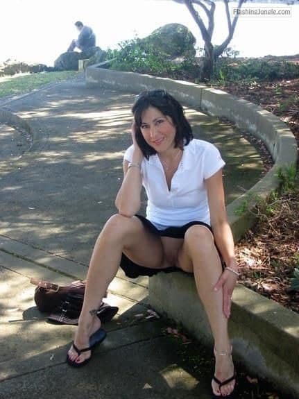 carelessinpublic:In a park in a short skirt and showing her... public nudity