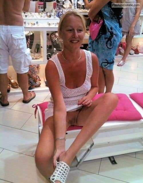 carelessinpublic:Mature lady inside a shop in a short dress and... public flashing