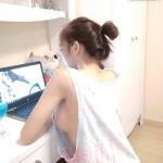 College girl sideboob while using laptop