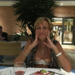 Slim blonde mature wife boobs out at hotel restaurant
