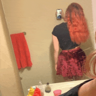 Redhead pulling up red skirt to flash ass in fishnets no panties gifs