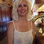 Mature blonde feeling sexy without bra under white tank top