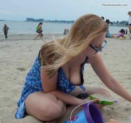Public Flashing Pics - Sideboob on beach – blonde wife with glasses in blue dress has juicy boob