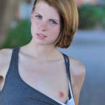 Freckle-faced teen lets us peek at her tight titties and firm…