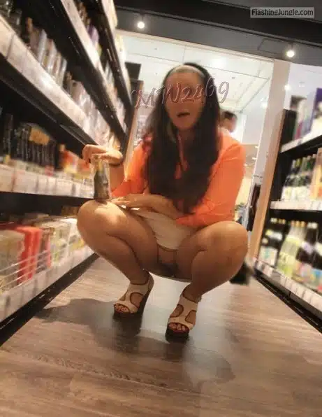 waptrick photo xxx squit not shaved pussy - Can You Spot Her Bare Pussy in the Aisle? A woman in a supermarket squats to reveal her bare pussy, teasing with a subtle smile while reaching for items on a lower shelf. - Flashing Store Pics