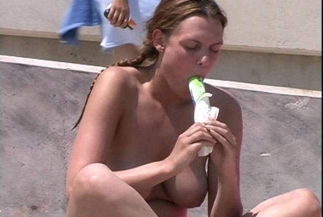 beach girl photo - Busty topless girl sucking icecream on the beach Source: Exhibitionists - Boobs Flash Pics