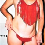 Beauty flashes with an exciting red costume