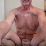 Mature guy still flashes his hanging cock