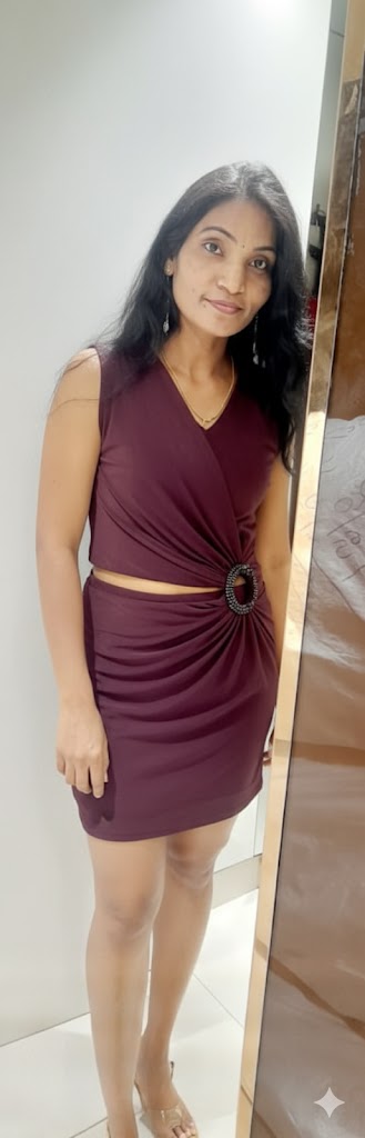 Bitch Flashing Pics: Maroon Dressed MILF Teases in Mirror Reflection A woman in a maroon dress stands confidently before a mirror, her reflection hinting at a bedroom setting. The dress, modest yet alluring, accentuates her cu...