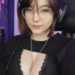 Midnight Confession: A Glimpse into Her Lace-Cutout Top