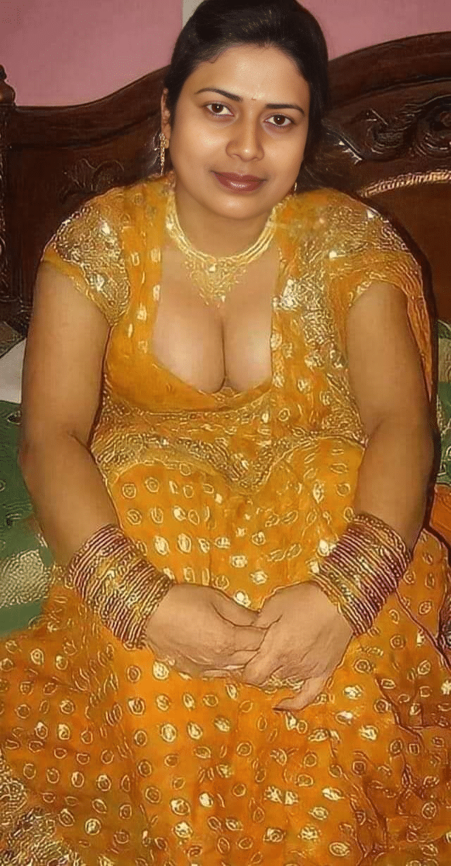 borwap yellow nigeria xxx - Mature MILF’s Tease: Cleavage on Display in Traditional Attire Sabita Pattnaik Chudri in a traditional yellow lehenga, showcasing cleavage in a bedroom setting with ornate jewelry. - Bitch Flashing Pics