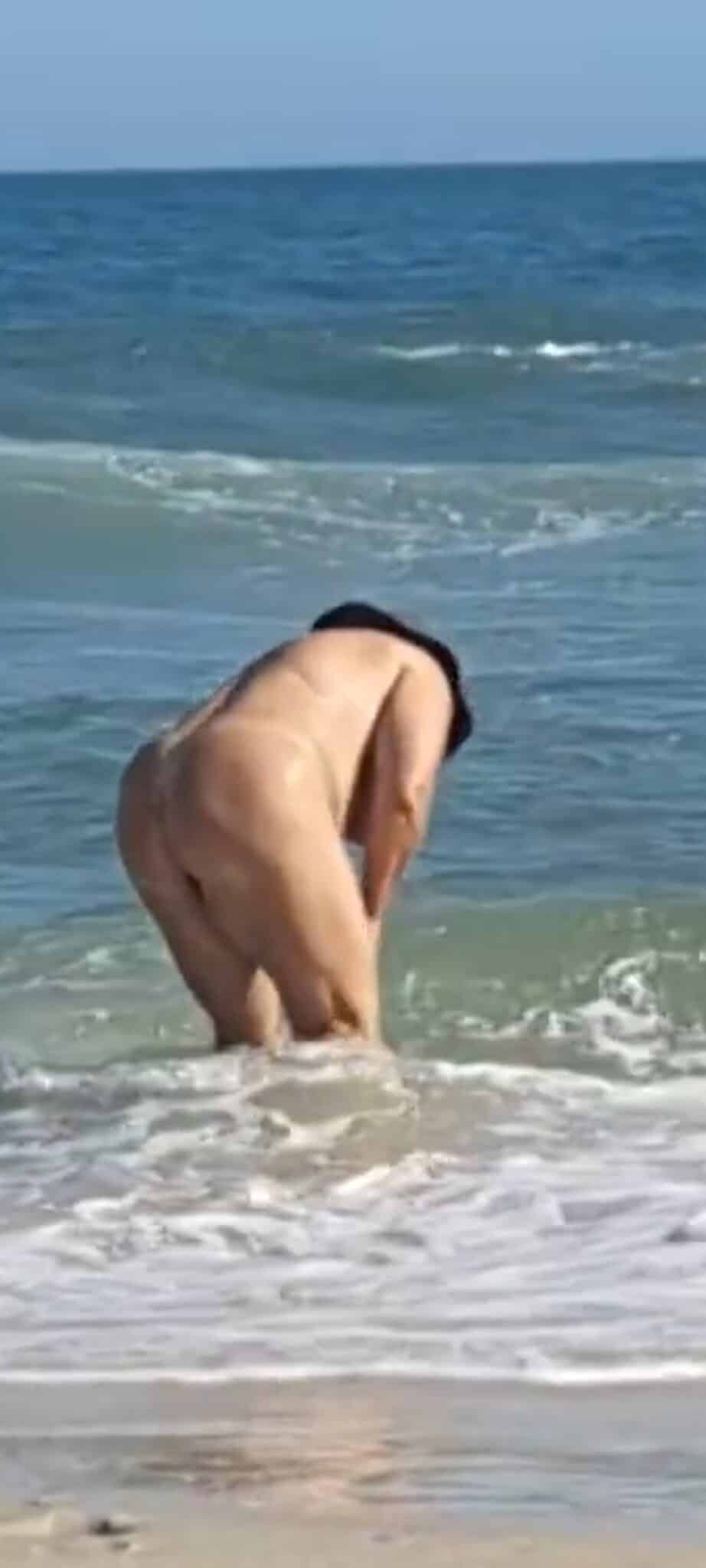 daughter nude ass - Why Is This Mature Woman Flashing Her Ass on the Beach? A mature woman stands nude on a beach, her ass and shaved pussy visible in a rear view. She's fully exposed, legs apart, hands near the water. The setting... - Ass Flash Pics