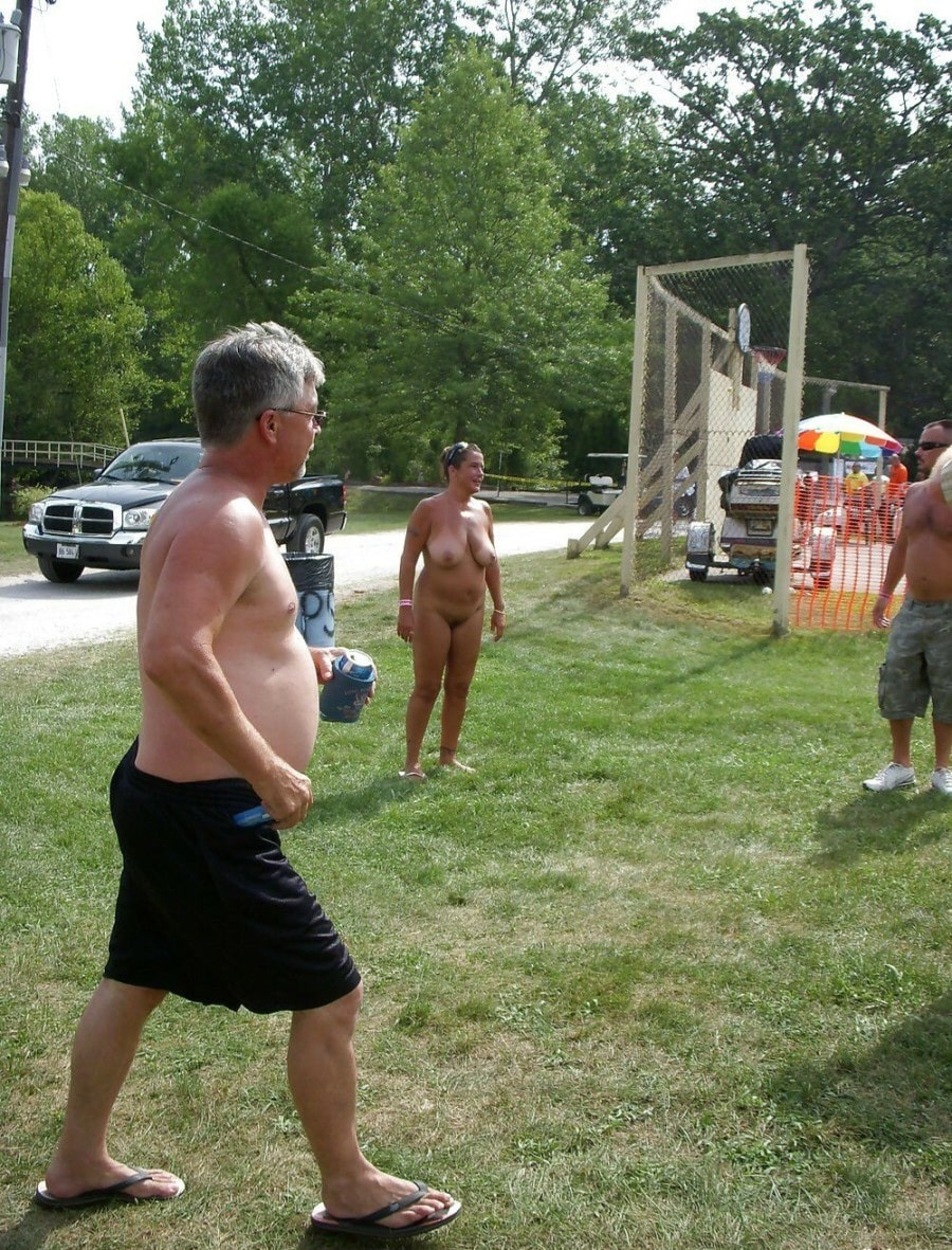 small puffy tits nude girl public changing room - Public Park Nudity: MILF Flashes in the Grass A MILF flashes in a public park setting, fully nude with small perky tits and a clean-shaven pussy, standing casually with two men in a grassy area. - Boobs Flash Pics