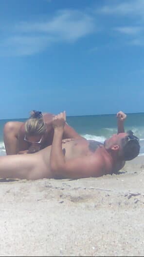 jumping topless bouncing titties public gifs - Public Passion: Beach Sex Unleashed A blonde woman rides a muscular man on a public beach, their naked bodies glistening under the sun. The scene captures raw, unfiltered passion amidst the oce... - Nude Beach Pics