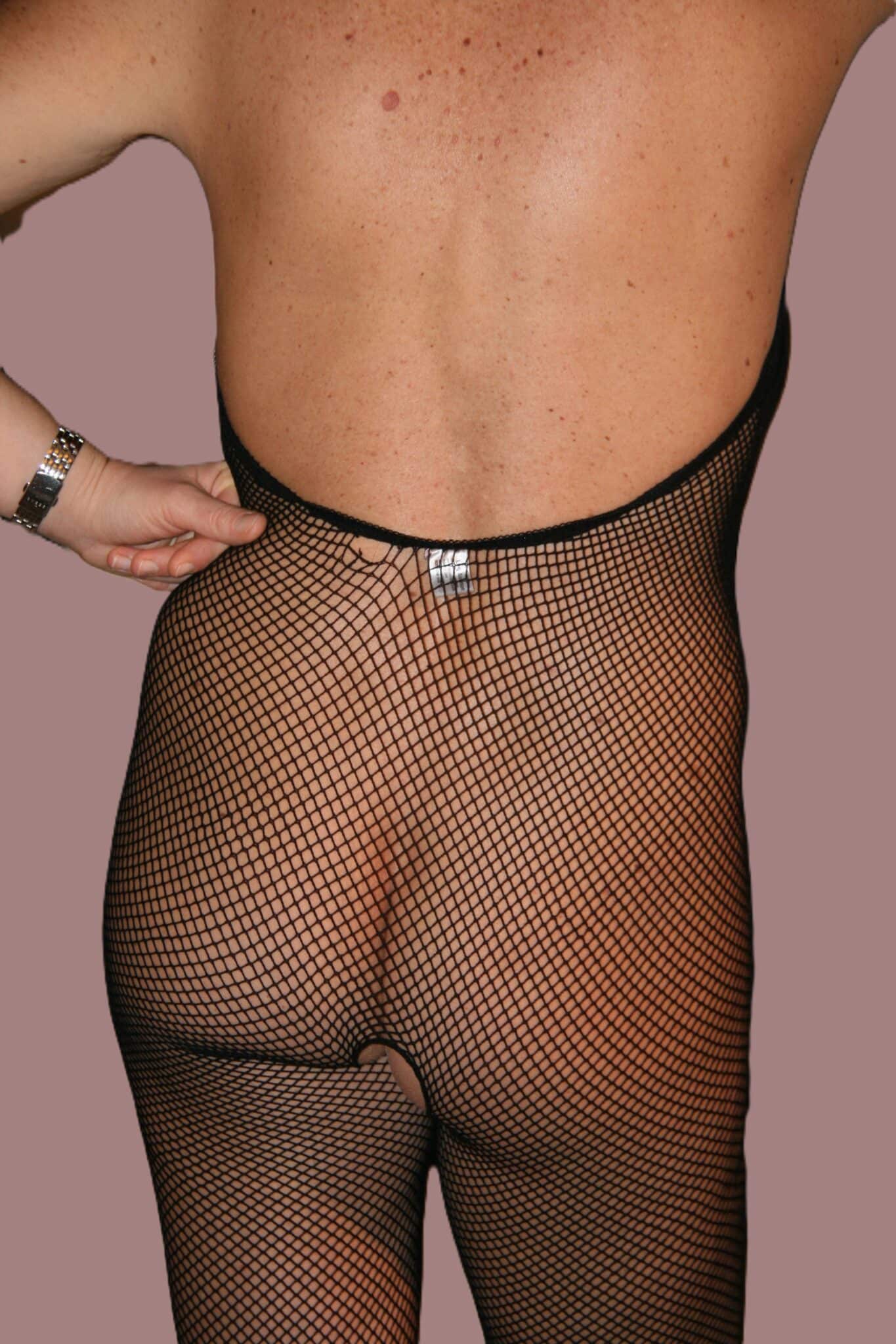 pics of a gal dressed in a fishnet mini upskirt no panties no bra dress - Malene’s Fishnet Tease: A Voyeur’s Delight A woman in a black fishnet bodystocking with an open crotch is captured in a close-up rear view, exposing her shaved pussy and firm ass. The indoor setting p... - Ass Flash Pics