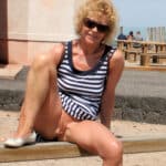 Public Tease: MILF Flashes in Striped Tankini