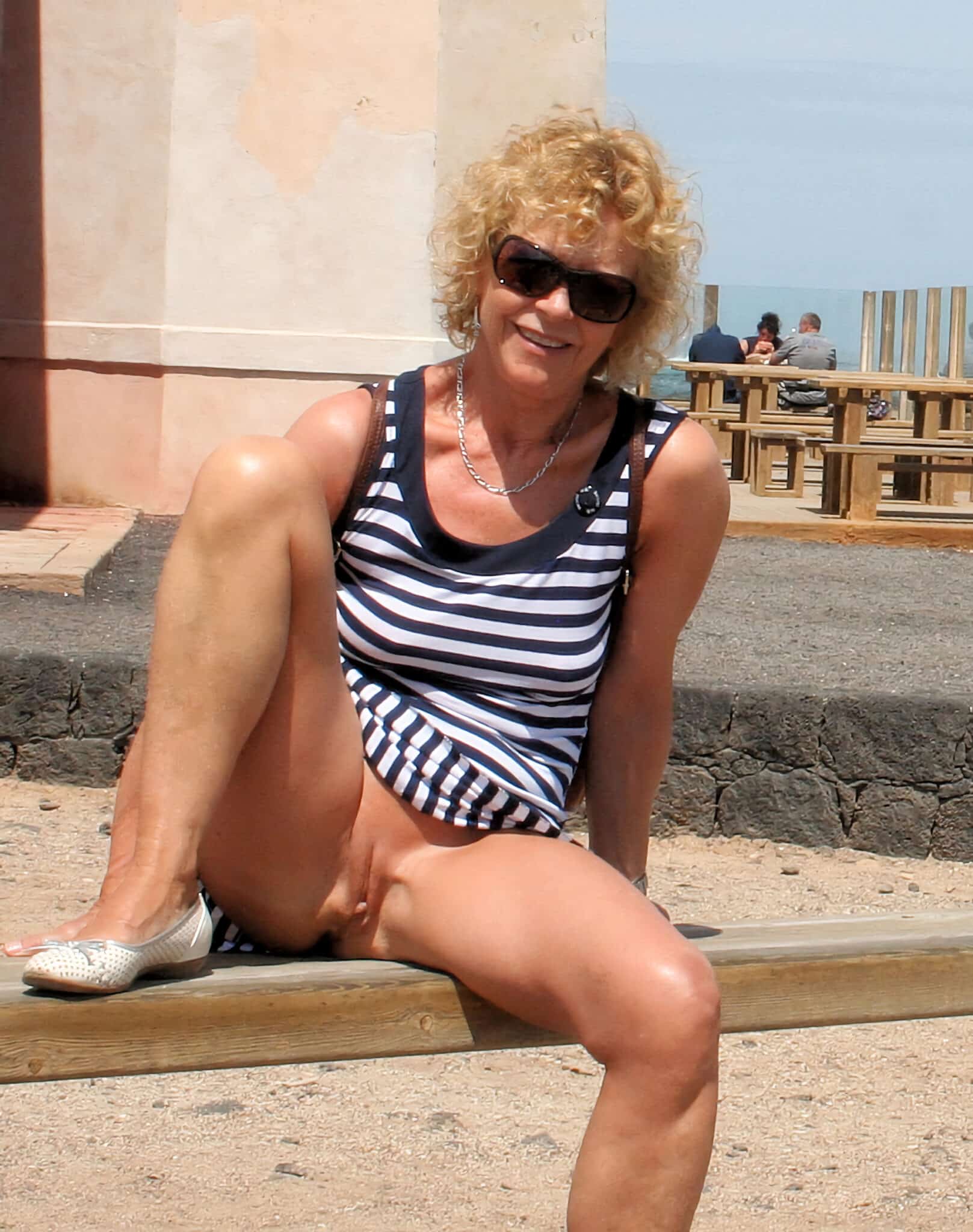 hot milf dressed miniskirt paints braless - Public Tease: MILF Flashes in Striped Tankini A MILF in a striped tankini teases onlookers in a public square, her confident stance and revealing outfit drawing attention. - Hotwife Pics