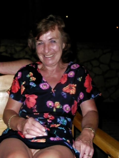 transparent dress pussy - Park Bench Voyeur: No Panties Under the Dress Mature woman in floral dress sits on park bench, no panties visible, thighs exposed, smiling confidently at camera. - No Panties Pics