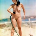 MILF Flashes Her Natural Assets on Public Beach