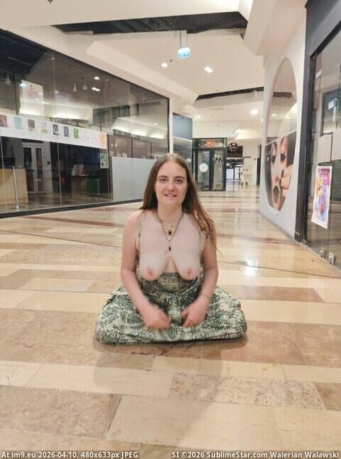 Bitch Flashing Pics: Arielle’s Mall Flashing: Caught in the Act Arielle's daring mall flashing captures attention as she reveals herself to shoppers, creating a thrilling scene of public nudity and voyeurism.