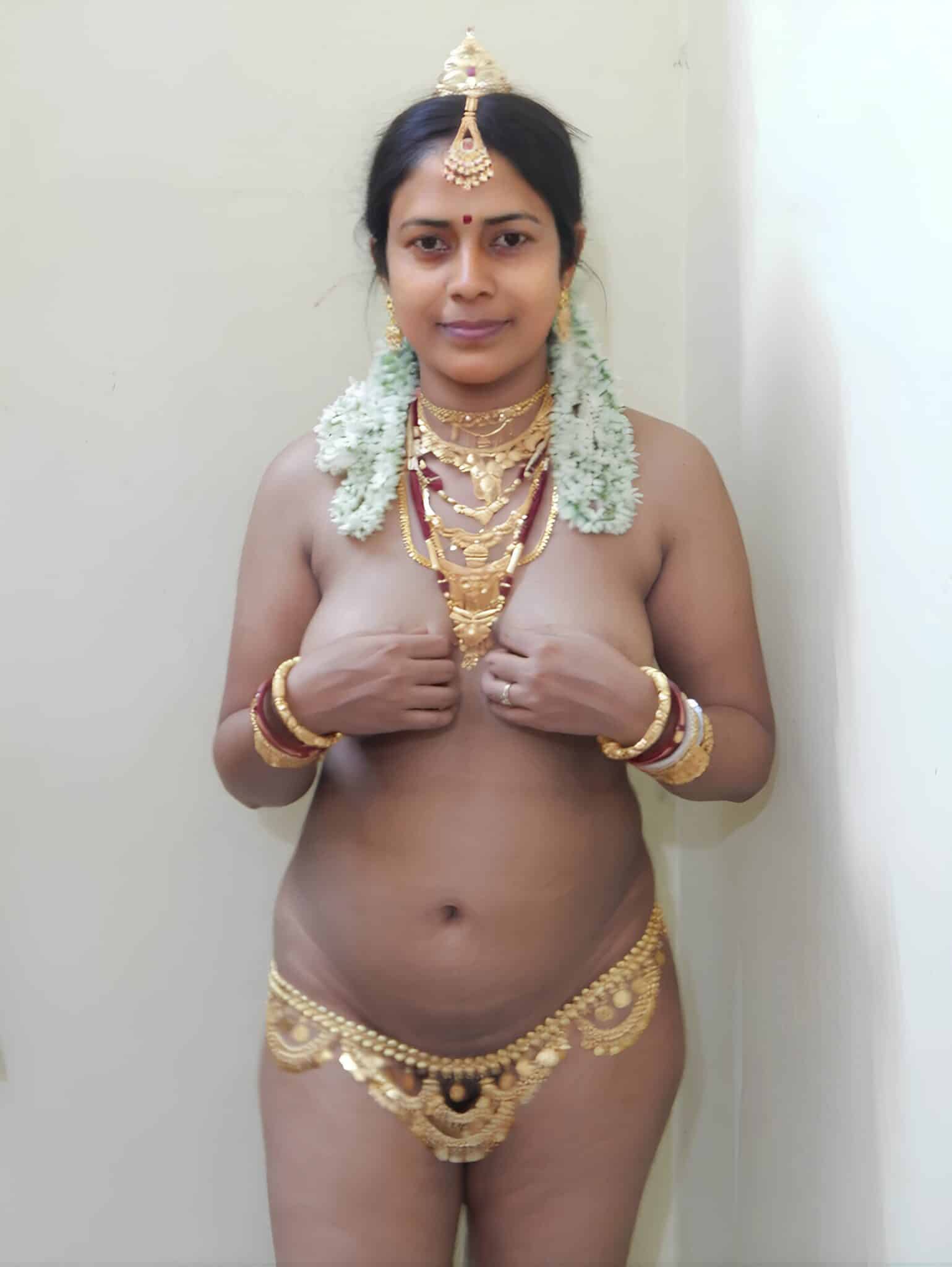 kaduna bitch hip and bombom picture - Why Does This MILF Flash Her Boobs in Gold Jewelry? A MILF in gold jewelry flashes her boobs, hands covering her chest, in a plain indoor setting. She wears a sheer garment with a gold hip chain, her expressio... - Bitch Flashing Pics