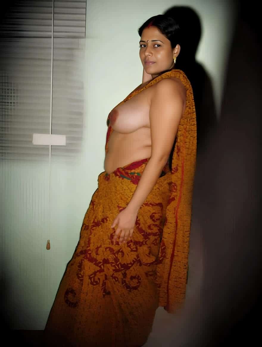 Bitch Flashing Pics: Bedroom Confession: Mature MILF Flashing Her Boobs Mature MILF flashes her boobs in a bedroom setting, sari draped to expose her torso, nipples erect and visible. Neutral expression, confident gaze.