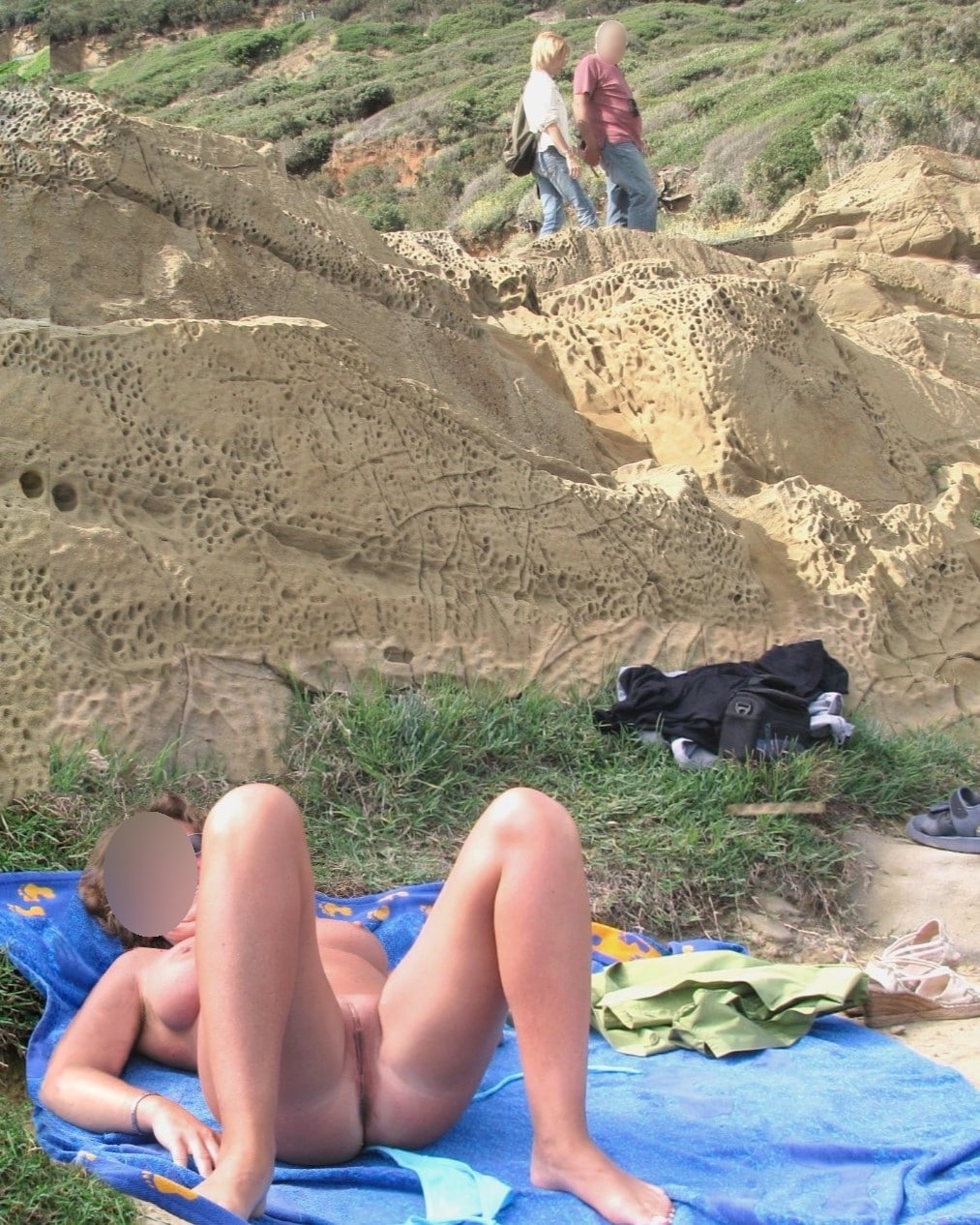 threesome kenyan porn pics - Who’s Watching Her Spread Eagled on the Beach? A nude woman lies spread eagled on a beach towel, legs wide open, in a rocky coastal area. Voyeuristic figures blur in the background, adding to the public n... - Ass Flash Pics