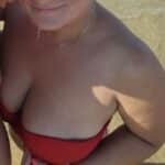MILF Flashes Her Massive Melons on the Beach