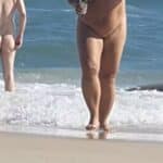 MILF Flashes Thong on Nude Beach