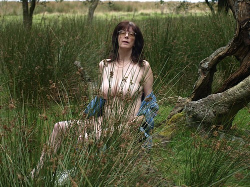 peeping at public nude beach - Mature MILF Flashes Her Boobs in Public Mature MILF flashes her boobs in public, sitting in tall grass with her shirt open, exposing her torso and genitals. - Boobs Flash Pics