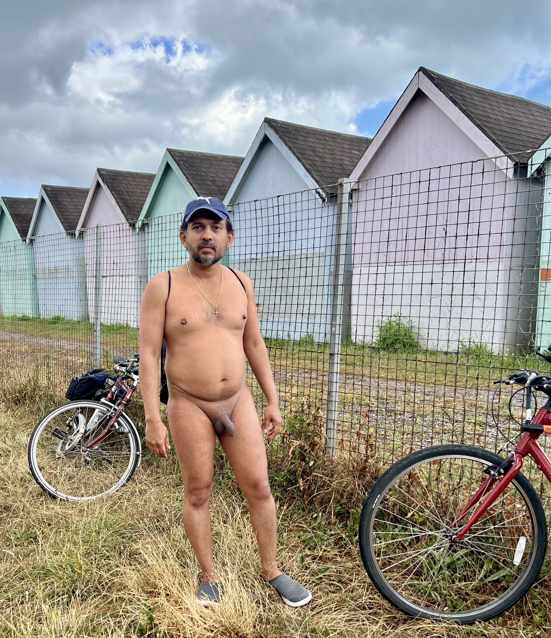 Dick Flash Pics: Beachside Nudity: A Bold Display of Confidence A man stands nude in a public setting, exuding confidence and freedom. His body language and direct gaze challenge societal norms, celebrating the human form...