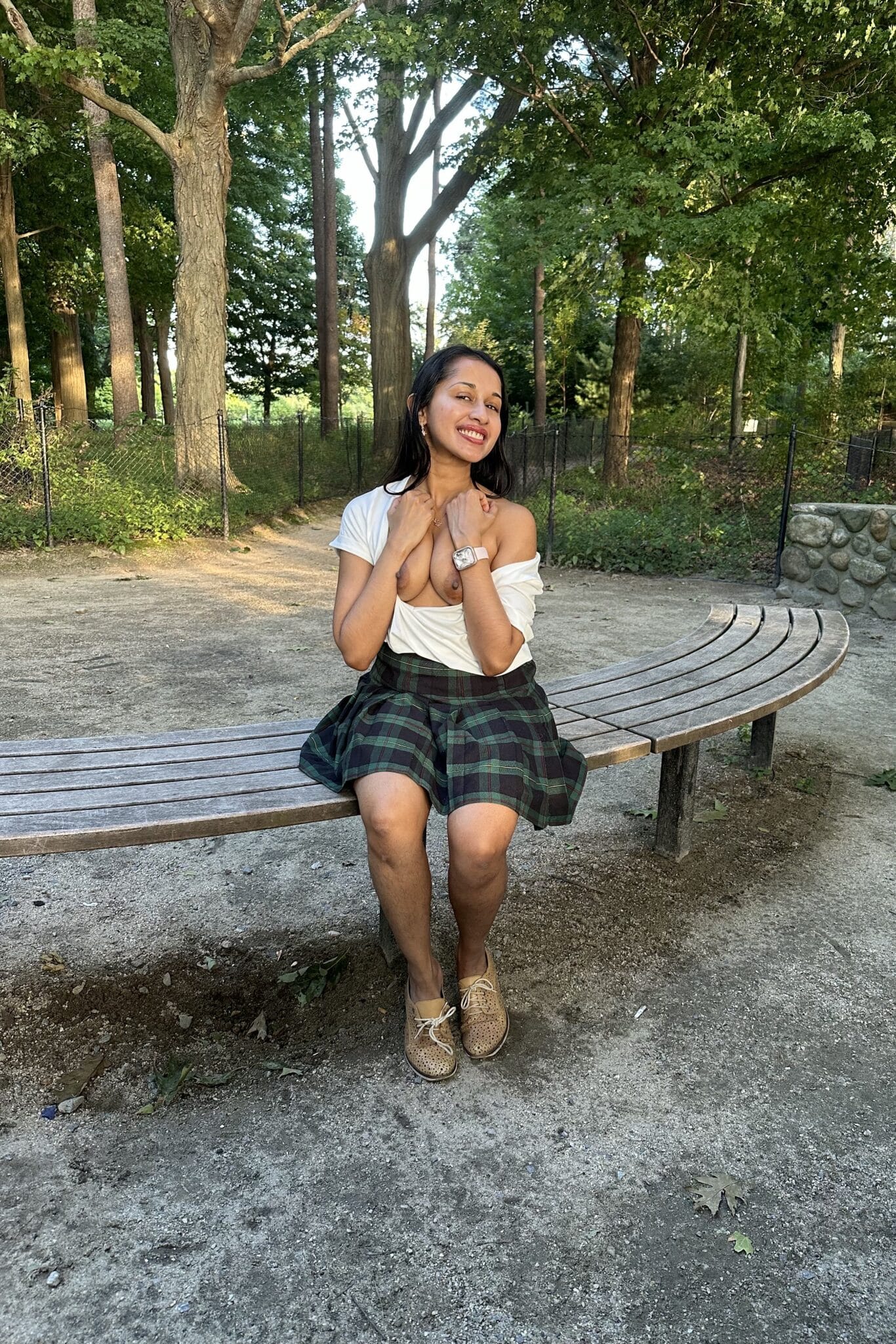 waptrick xxnxx image - Can You Spot the Tamil NRI Girl Flashing Her Tits in the Park? A South Asian woman sits on a park bench, flashing her breasts in a public setting, with a playful expression and direct gaze. - Bitch Flashing Pics