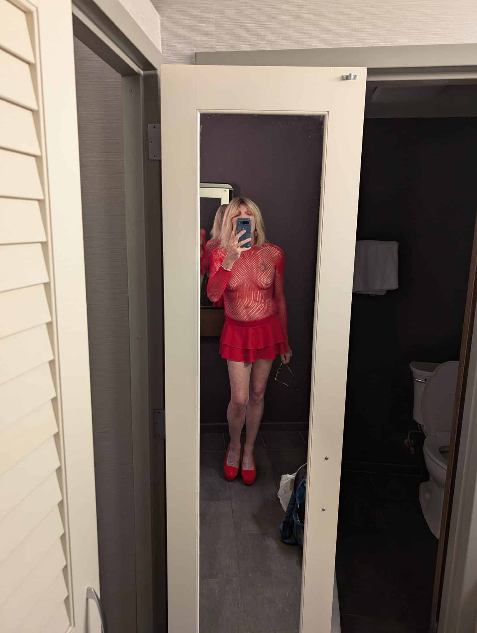„hans juergen kunze“ flashingjungle - Mature Jane’s Bold Bathroom Selfie A mature woman takes a bold mirror selfie in a bathroom, dressed in a revealing red fishnet top and mini skirt, capturing a moment of self-confidence and per... - Bitch Flashing Pics